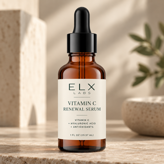 Vitamin C Renewal Serum bottle on a stone pedestal in natural light.